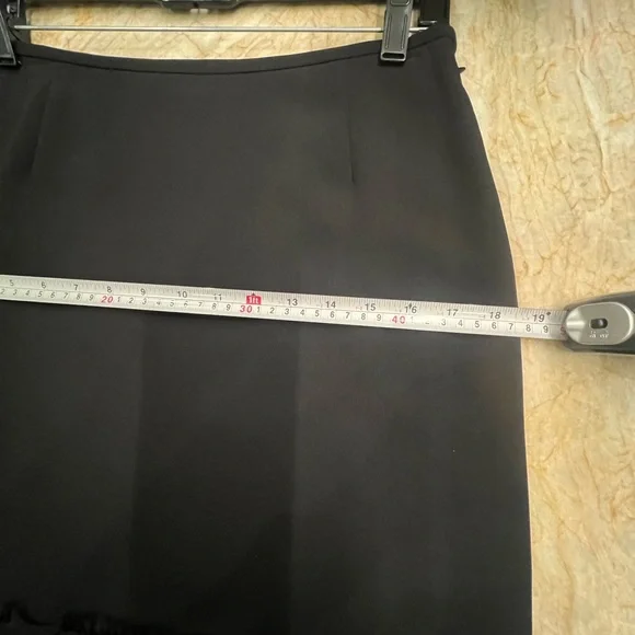 Chic Black Midi Skirt with Embellished Hem